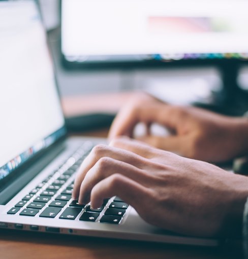 Hands at Laptop